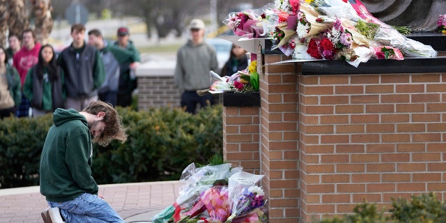 Students and staff have begun removing flowers left for victims of the Michigan State University shooting at campus landmarks.