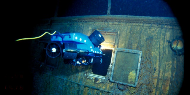 In this image provided by the Woods Hole Oceanographic Institution, an underwater remote vehicle examines an open window of the Titanic 12,500 feet (3.8 kilometers) below the surface of the ocean, 400 miles (640 kilometers) off the coast of Newfoundland, Canada in 1986. 