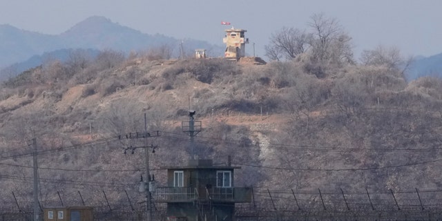 North Korean military guard posts, rear, and South Korea posts, bottom, are seen in Paju, South Korea, near the border with North Korea.