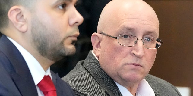 Robert E. Crimo Jr. and his attorney George Gomez, appear before Judge George D. Strickland at the Lake County Courthouse, Feb. 16, 2023, in Waukegan, Ill.