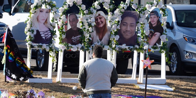 Portraits of the victims of a mass shooting at a gay nightclub are displayed at a makeshift memorial near Colorado Springs. A hearing is to conclude Thursdays to determine is the accused shooter will stand trial. 