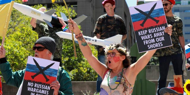 A protest is held outside the Russian consulate in Cape Town, South Africa, Friday, Feb. 17, 2023.