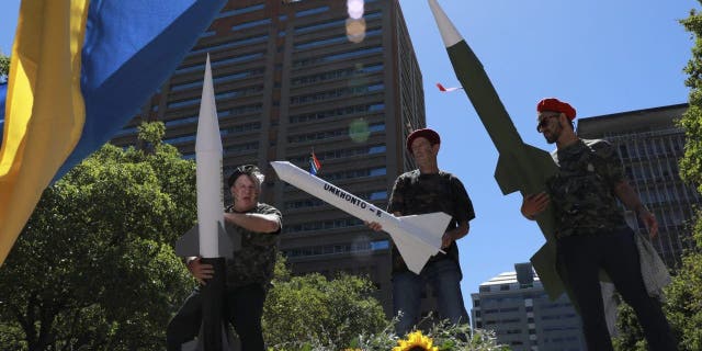 A protest is held outside the Russian consulate in Cape Town, South Africa, Friday, Feb. 17, 2023, against naval exercises off the east coast of the country.