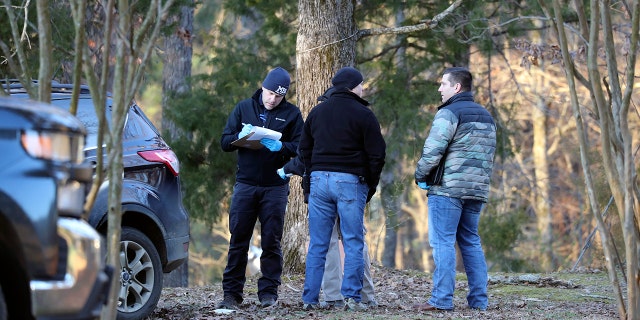 Law enforcement personnel investigate the scene of multiple shootings on Arkabutla Dam Road in Arkabutla, Mississippi, on Friday, Feb. 17, 2023. 