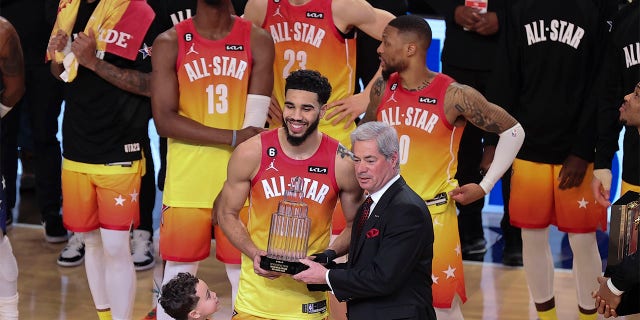 Team Giannis forward Jayson Tatum (0) receives his Most Valuable Player trophy after the NBA All-Star Game on Sunday, February 19, 2023, in Salt Lake City. 