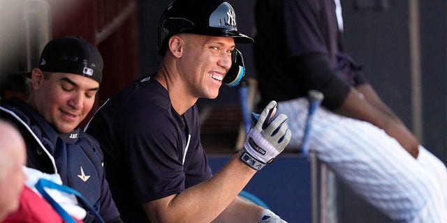 New York Yankees' Aaron Judge points from the dugout during a spring training baseball workout Monday, Feb. 20, 2023, in Tampa, Florida.
