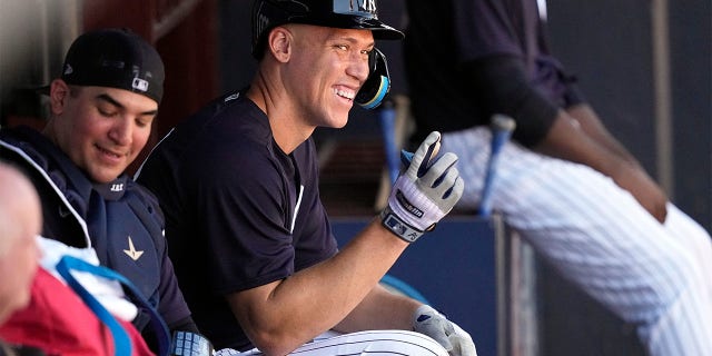 New York Yankees' Aaron Judge points from the dugout during a spring training baseball workout Monday, Feb. 20, 2023, in Tampa, Florida.