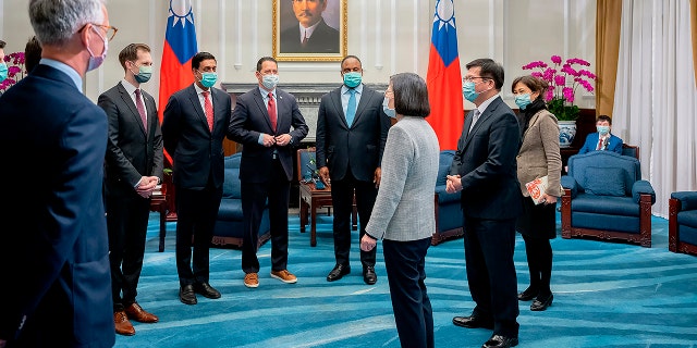 In this photo released by the Taiwan Presidential Office, Taiwan's President Tsai Ing-wen, center, meet with a U.S. delegation led by California Rep. Ro Khanna, third from left during a meeting at the Presidential Office in Taipei, Taiwan on Tuesday, Feb. 21, 2023.