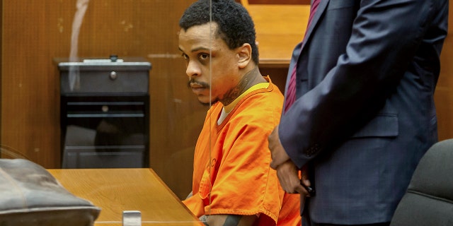 FILE - Eric Holder Jr. sits in the courtroom at Clara Shortridge Foltz Criminal Justice Center on Sept. 15, 2022, in Los Angeles. 