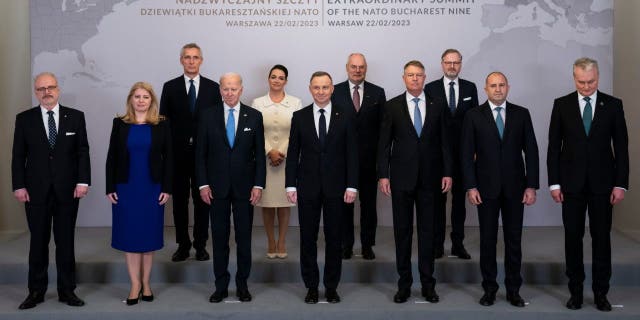 Leaders of the Bucharest Nine countries Feb. 22, 2023, in Warsaw.  From left to right are Latvian President Egils Levits, Slovakia President Suzana Caputova, NATO Secretary General Jens Stoltenberg, Biden, Hungarian President Katalin Novák, Polish President Andrzej Duda, Estonia President Alar Karis, Romania President Klaus Werner Iohannis, Czech Republic Prime Minister Petr Fiala, Bulgaria President Ruman Radev and Lithuania President Gitanas Nauseda. 