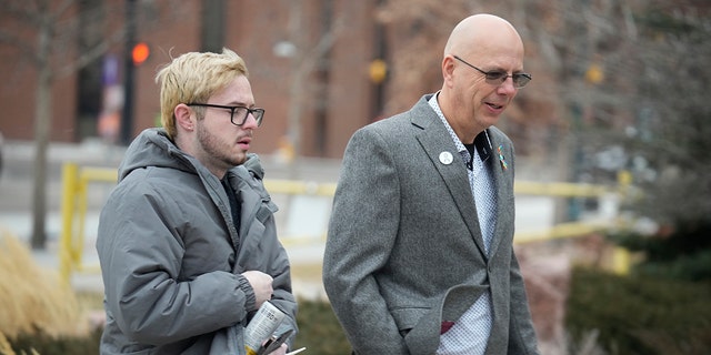 Michael Anderson, left, a survivor of the Club Q shooting, walked with the club's co-owner, Matthew Haynes, into the El Paso County courthouse for a preliminary hearing for Anderson Lee Aldrich. 