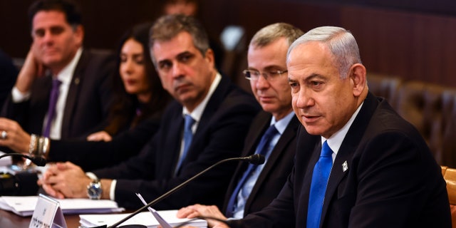 Israeli Prime Minister Benjamin Netanyahu convenes a cabinet meeting at the prime minister's office in Jerusalem, Thursday, Feb. 23, 2023. (Ronen Zvulun/Pool Photo via AP)