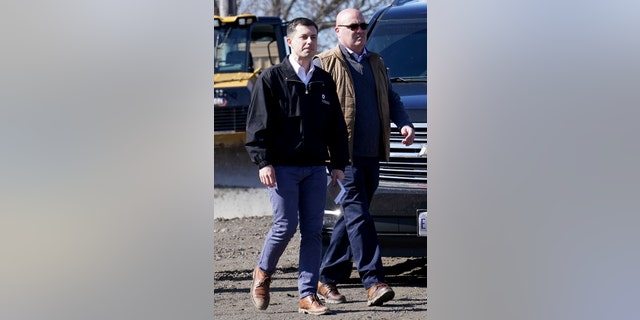 Transportation Secretary Pete Buttigieg arrives for a news conference Thursday, Feb. 23, 2023, near the site of the Feb. 3 Norfolk Southern train derailment in East Palestine, Ohio. (AP Photo/Matt Freed)
