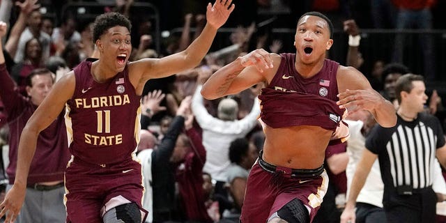 Florida State guard Matthew Cleveland, right, reacts after scoring the game-winning basket against Miami, Saturday, February 25, 2023, in Coral Gables.