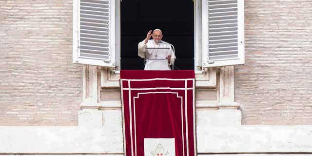 Pope Francis recites the Angelus noon prayer from the window of his studio at the Vatican on Feb. 26, 2023. Francis is set to visit Hungary at the end of April.