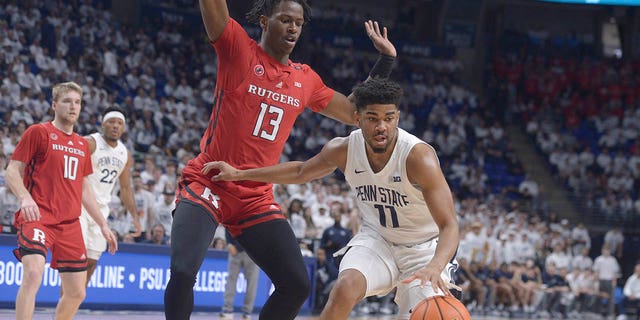Rutgers' Antwone Woolfolk (13) defends against Penn State's Camren Wynter (11) during the first half of an NCAA college basketball game, Sunday, Feb. 26, 2023, in State College, Pa. 