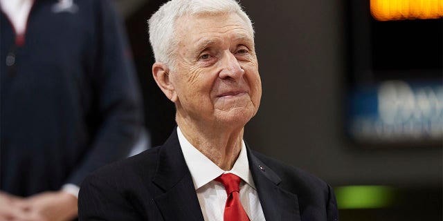 Former Davidson basketball player, coach, and athletic director, and former Virginia coach, Terry Holland, smiles during a ceremony to retire his jersey number 42 following an NCAA college basketball game between LaSalle and Davidson on Sunday, Jan. 30, 2022, in Davidson, North Carolina. Holland, who elevated Virginia basketball to national prominence during 16 seasons as coach and later had a distinguished career as an athletic administrator, has died, the school announced Monday, Feb. 27, 2023. He was 80.