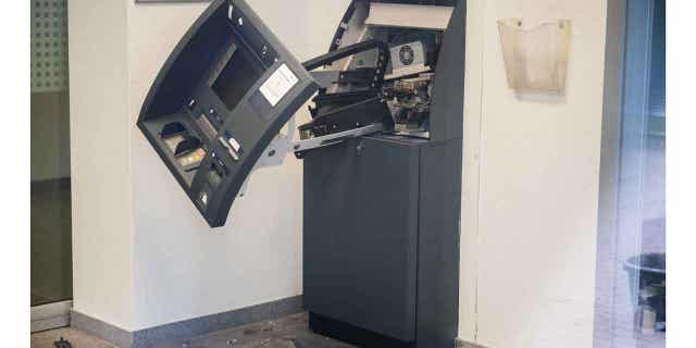 A destroyed cash machine stands in a branch of the Hannoversche Volksbank. German authorities arrested nine suspects in connection with ATM explosions across the country.