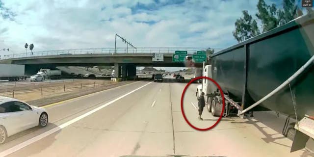 An unidentified man was reportedly unharmed after crossing a busy Arizona interstate.