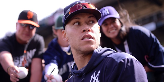 New York Yankees right fielder Aaron Judge signs autographs during the Giants game at Oracle Park on April 27, 2019, in San Francisco.