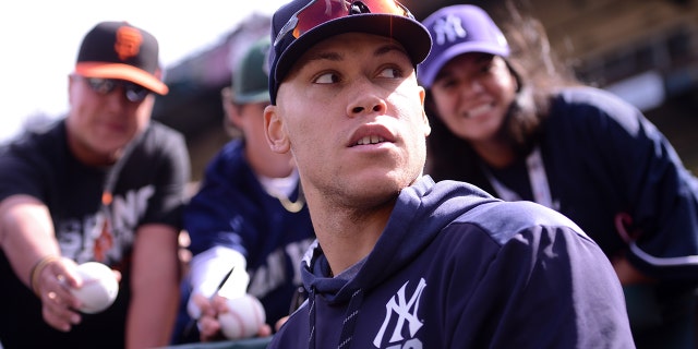 New York Yankees right fielder Aaron Judge signs autographs during the Giants game at Oracle Park on April 27, 2019, in San Francisco.