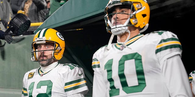 Aaron Rodgers #12 and Jordan Love #10 of the Green Bay Packers look on prior to the game against the Tennessee Titans at Lambeau Field on November 17, 2022 in Green Bay, Wisconsin. 