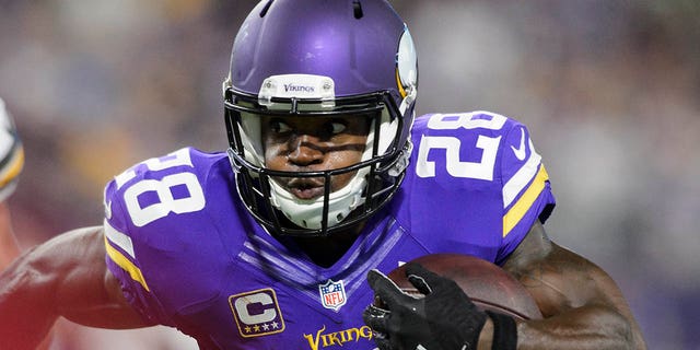 Adrian Peterson of the Minnesota Vikings charges the ball against the Green Bay Packers on September 18, 2016 at US Bank Stadium in Minneapolis.