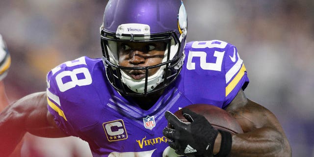 Adrian Peterson of the Minnesota Vikings charges the ball against the Green Bay Packers on September 18, 2016 at US Bank Stadium in Minneapolis.