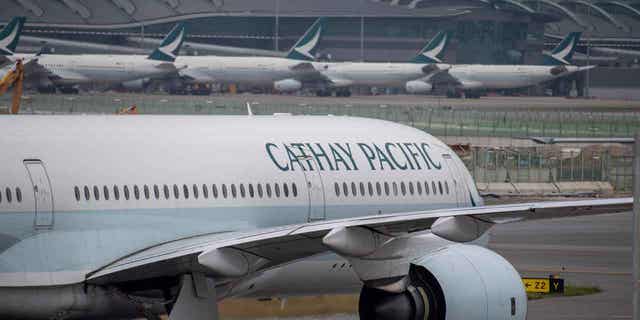 A Cathay Pacific airplane is shown at Hong Kong International Airport on Nov. 25, 2022. Hong Kong will give away air tickets and vouchers to attract tourists. Hong Kong relaxed its entry rules regarding COVID-19 much later than other popular travel destinations.
