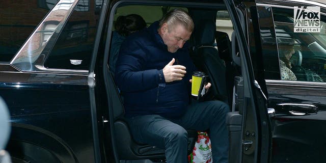 Alec Baldwin gets out of a car outside his apartment in Manhattan, Feb. 1, 2023. The actor has been officially charged with involuntary manslaughter for the shooting death of Halyna Hutchins on the set of Rust in October 2021.