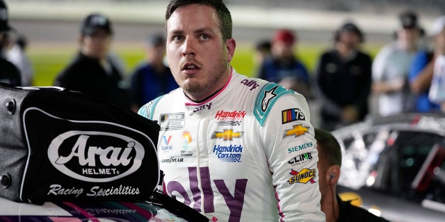 Alex Bowman climbs out of his car after qualifying for the NASCAR Daytona 500 auto race at Daytona International Speedway, Wednesday, Feb. 15, 2023, in Daytona Beach, Fla.