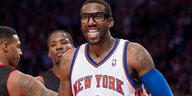 New York Knicks forward Amare Stoudemire, No. 1, reacts after scoring against the Toronto Raptors in the fourth quarter of their NBA basketball game at Madison Square Garden in New York, March 20, 2012. 