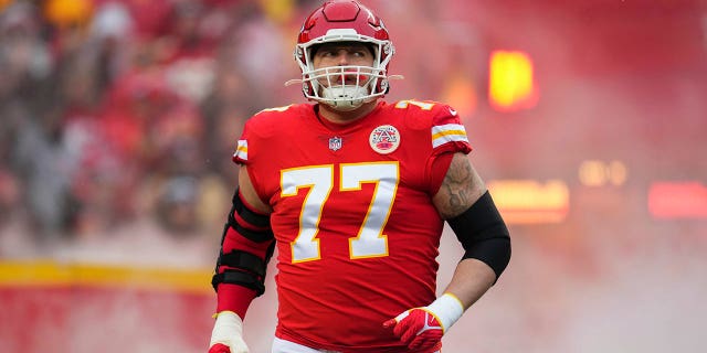 Andrew Wylie of the Kansas City Chiefs runs onto the field during introductions against the Jacksonville Jaguars at GEHA Field at Arrowhead Stadium on January 21, 2023 in Kansas City, Missouri.