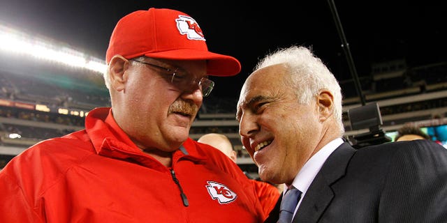 Jeffrey Lurie, owner of the Philadelphia Eagles, greets head coach Andy Reid of the Kansas City Chiefs before a game on September 19, 2013 at Lincoln Financial Field in Philadelphia.