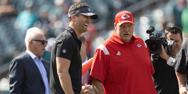Philadelphia Eagles head coach Nick Sirianni, left, talks to Kansas City Chiefs head coach Andy Reid, right, as Eagles owner Jeffrey Lurie looks on prior to the game at Lincoln Financial Field on Oct. 3, 2021 in Philadelphia.