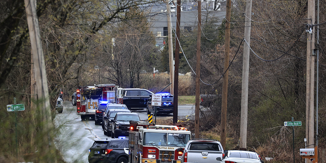 Emergency vehicles respond to the scene where a plane crashed shortly after taking off from the Bill and Hillary Clinton National Airport in Little Rock, Arkansas, on Wednesday Feb. 22, killing 5 on board.
