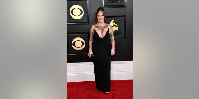 Ashley McBryde takes the plunge in a daring strapless gown on Grammys red carpet. 