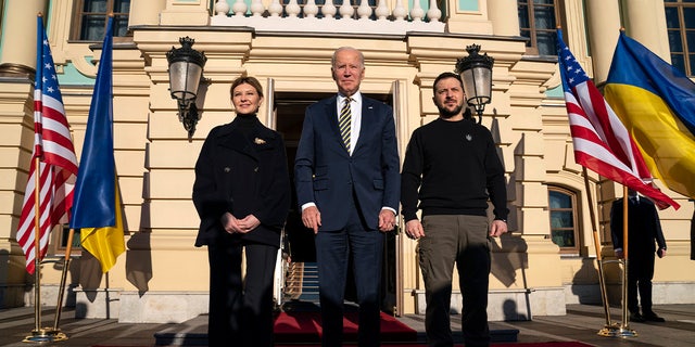 President Joe Biden (center) poses with Ukrainian President Volodymyr Zelensky (right) and President Zelensky's spouse Olena Zelensky (left) during an unannounced visit at the Mariinsky Palace.