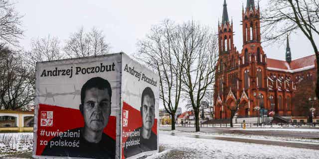 A banner with a picture of Belarusian-Polish journalist Andrzej Poczobut is seen in the center of Bialystok, Poland, on Jan. 21, 2023. Poczobut was sentenced to eight years in prison for "inciting discord" and harming the country's national security.