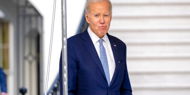 President Joe Biden walks toward members of the media before boarding Marine One on the South Lawn of the White House in Washington, Friday, Feb. 24, 2023, for travel to Wilmington, Delaware.