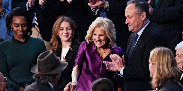 First Lady Jill Biden and Second Gentleman Douglas Emhoff spotted at President Biden's second State of the Union. The pair shared a kiss ahead of the President's address to Congress. 