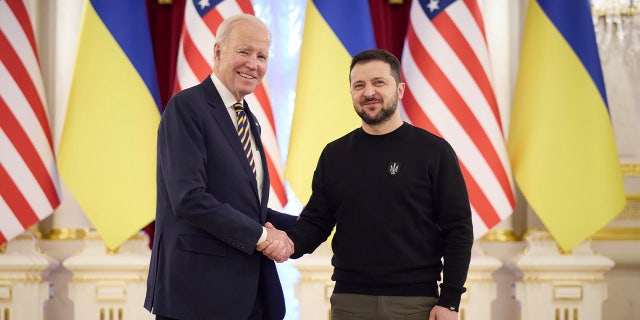 Ukrainian President Volodymyr Zelenskyy, right, and President Biden shake hands during their meeting in Kyiv, Ukraine, Feb. 20, 2023.