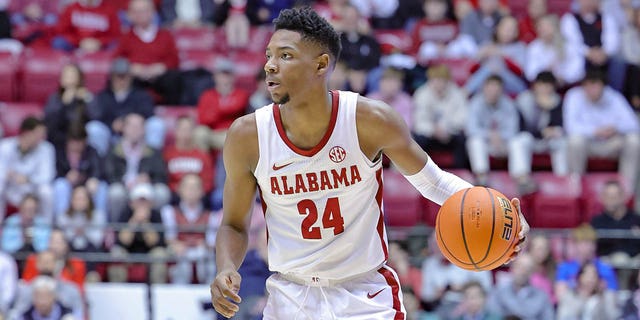 Brandon Miller #24 of the Alabama Crimson Tide looks for a lane during the first half against Vanderbilt Commodores at Coleman Coliseum on January 31, 2023 in Tuscaloosa, Alabama.