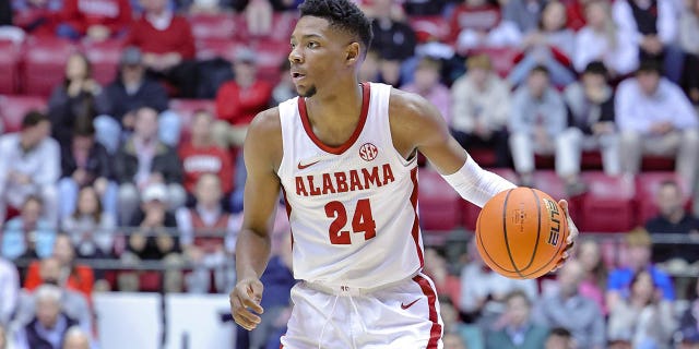 Brandon Miller #24 of the Alabama Crimson Tide looks for a lane during the first half against the Vanderbilt Commodores at Coleman Coliseum on January 31, 2023, in Tuscaloosa, Alabama.