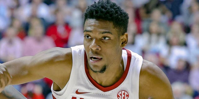 Brandon Miller #24 of the Alabama Crimson Tide drives to the basket against Kendal Coleman #4 of the LSU Tigers during the second period at Coleman Coliseum on January 14, 2023, in Tuscaloosa, Alabama.