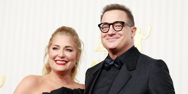 Brendan Fraser wore an all-black suit while his wife Jeanne Moore rocked a strapless black dress.