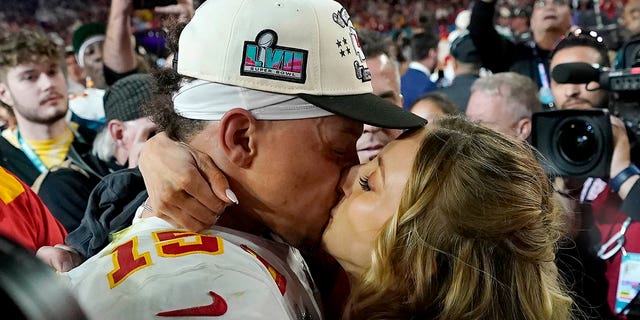 Kansas City Chiefs quarterback Patrick Mahomes kisses his wife, Brittany, after Super Bowl LVII, Sunday, Feb. 12, 2023, in Glendale, Arizona.
