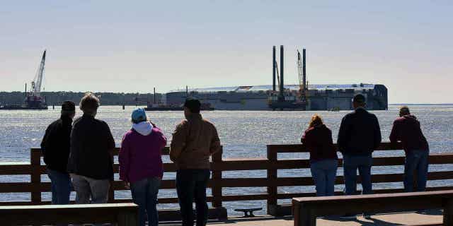 A vehicle carrier, loaded with 4,200 new cars, capsized as it was leaving the Port of Brunswick on Feb. 27, 2020. An expansion of the seaport in Brunswick, Georgia, was signed by the state's port authority and a federal agency.