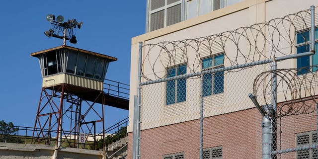 Barbed wire and a guard tower is seen at San Quentin State Prison on April 12, 2022, in San Quentin, CA.