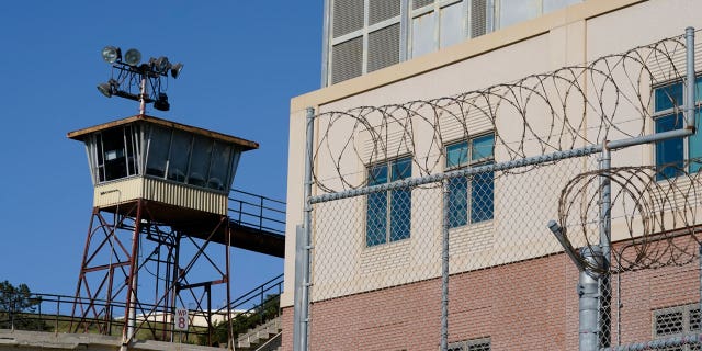 Barbed wire and a guard tower is seen at San Quentin State Prison on April 12, 2022, in San Quentin, CA.